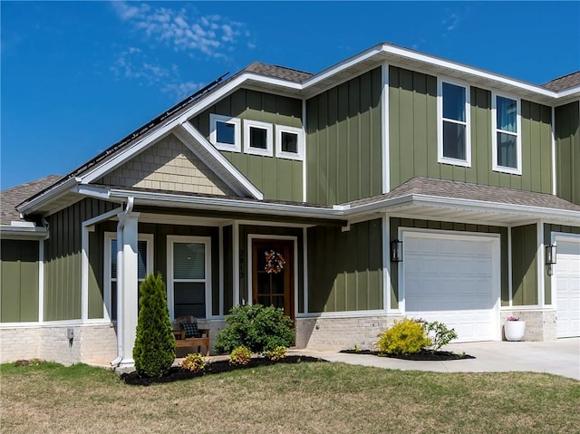 craftsman inspired home with a porch, a shingled roof, board and batten siding, and driveway