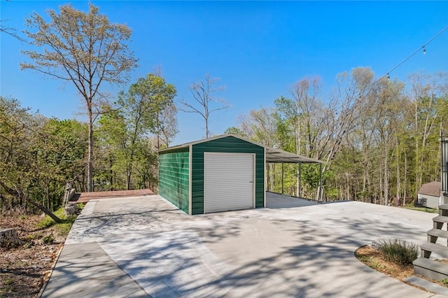 garage featuring a garage and concrete driveway