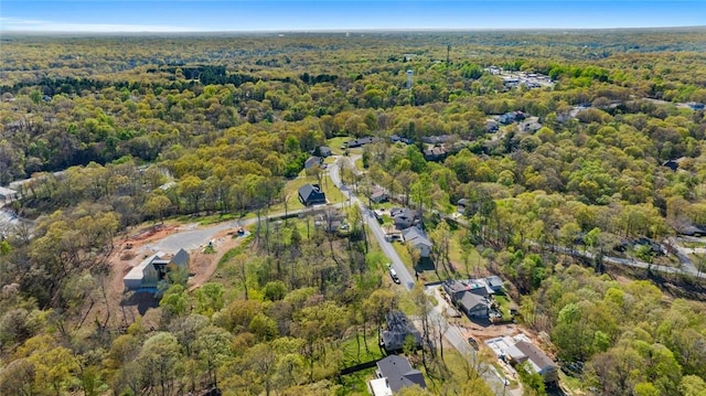 drone / aerial view featuring a forest view