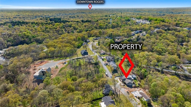 bird's eye view featuring a wooded view