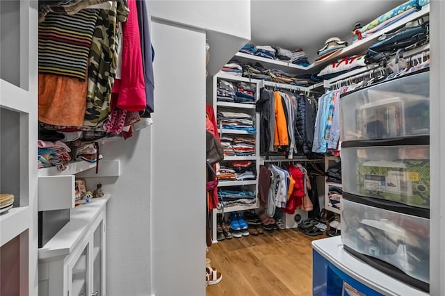 spacious closet with wood finished floors