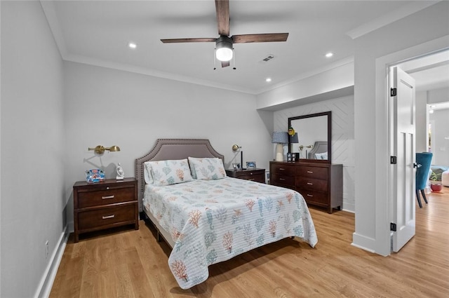 bedroom featuring recessed lighting, visible vents, light wood-type flooring, crown molding, and baseboards