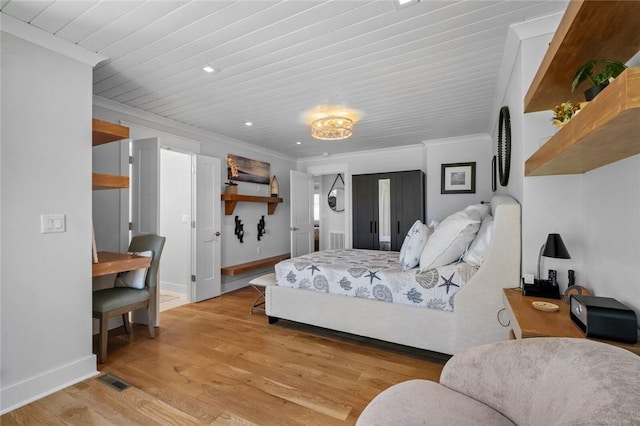 bedroom with a chandelier, light wood-style floors, baseboards, ornamental molding, and recessed lighting