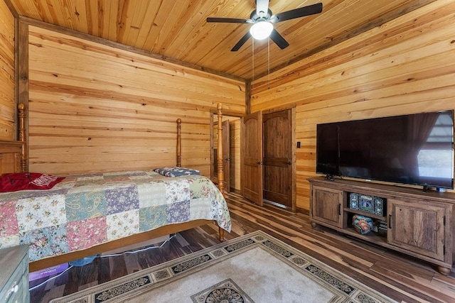 bedroom with wood ceiling, wooden walls, wood finished floors, and ceiling fan