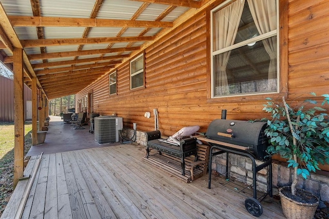 wooden terrace featuring cooling unit
