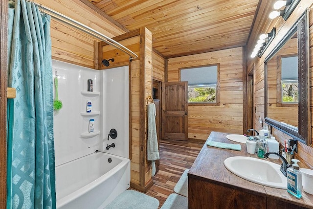 full bathroom with wood finished floors, vanity, shower / bathtub combination with curtain, wooden ceiling, and wood walls
