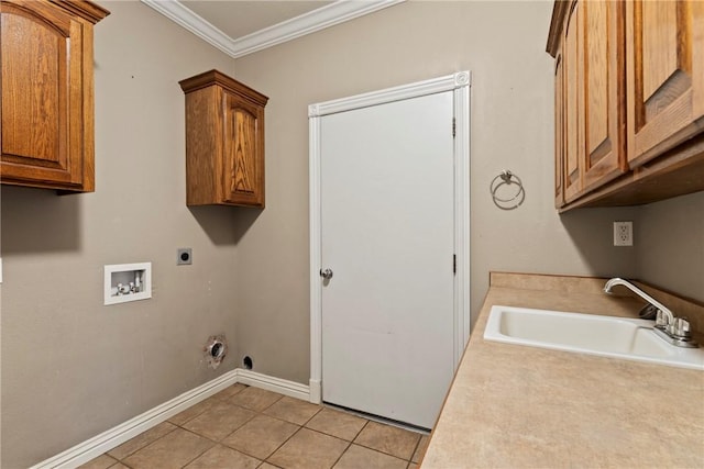 washroom featuring a sink, electric dryer hookup, light tile patterned flooring, cabinet space, and ornamental molding