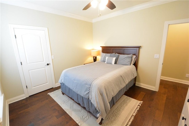 bedroom featuring baseboards, a ceiling fan, wood finished floors, and crown molding