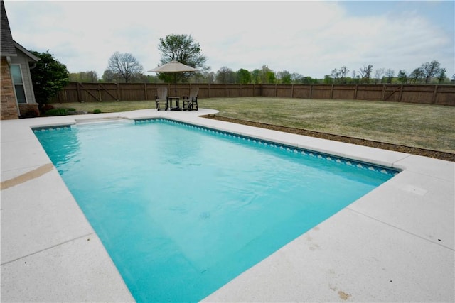 view of pool featuring a yard, a fenced in pool, a patio, and a fenced backyard
