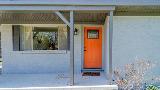 entrance to property with brick siding