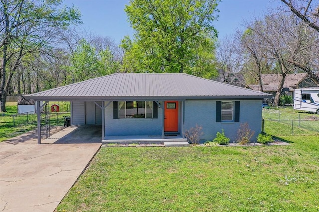 single story home with a porch, driveway, a front yard, fence, and an attached carport
