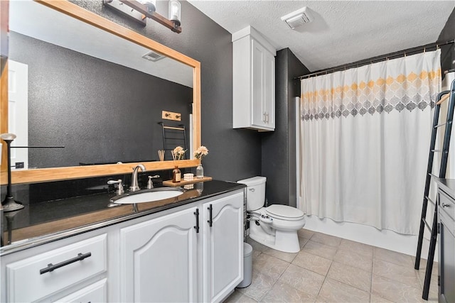 bathroom with a textured ceiling, toilet, tile patterned flooring, shower / bath combination with curtain, and vanity