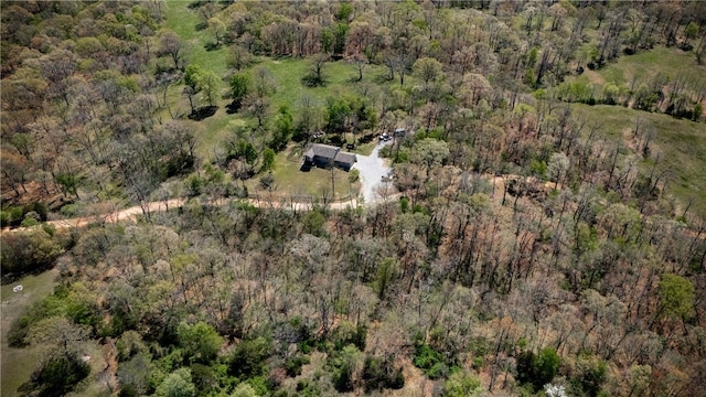 birds eye view of property with a forest view