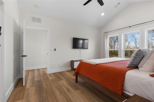 bedroom featuring light wood-style flooring, baseboards, lofted ceiling, visible vents, and recessed lighting