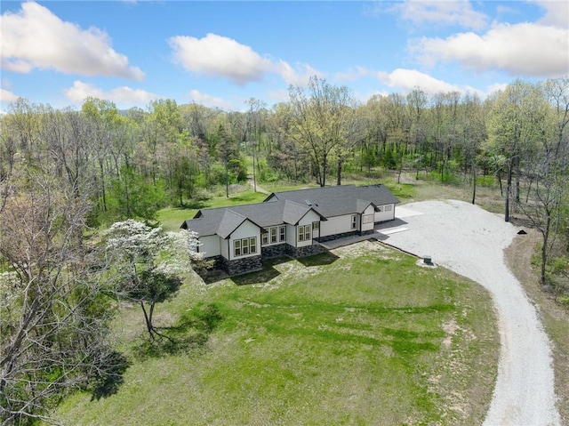 drone / aerial view with a view of trees
