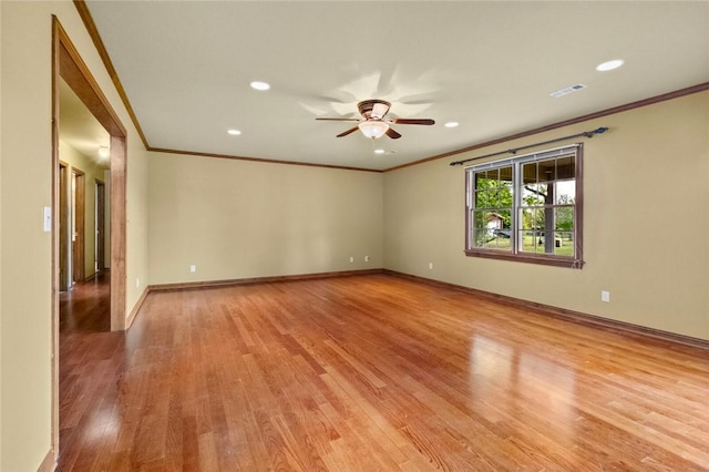 511 N Oakwood St, Lowell, AR 72745 - spare room featuring crown molding, ceiling fan, light wood-type flooring, and visible vents