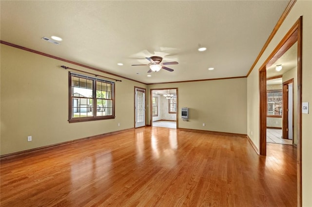 511 N Oakwood St, Lowell, AR 72745 - empty room with baseboards, ornamental molding, light wood-style flooring, and ceiling fan with notable chandelier