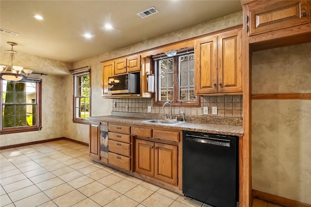 511 N Oakwood St, Lowell, AR 72745 - kitchen with visible vents, a sink, stainless steel microwave, and dishwasher