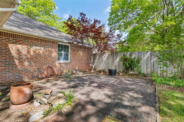 511 N Oakwood St, Lowell, AR 72745 - view of patio with fence