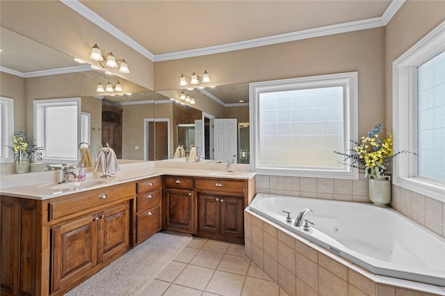 bathroom with crown molding, a sink, a whirlpool tub, double vanity, and tile patterned flooring