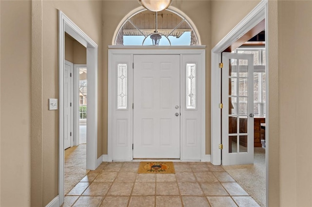 entryway featuring baseboards