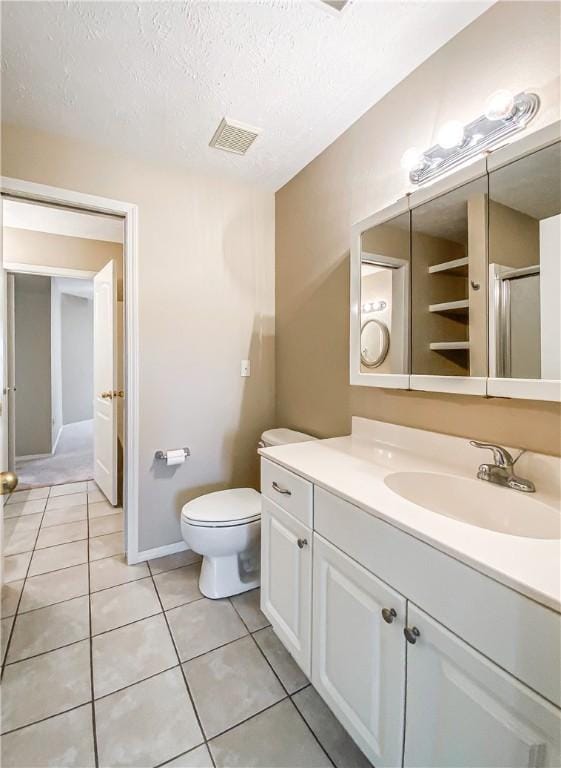 full bathroom with vanity, visible vents, tile patterned flooring, and a textured ceiling