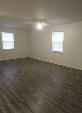 unfurnished room featuring dark wood finished floors