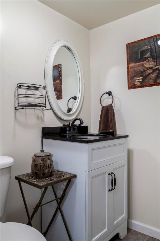 half bath with toilet and vanity