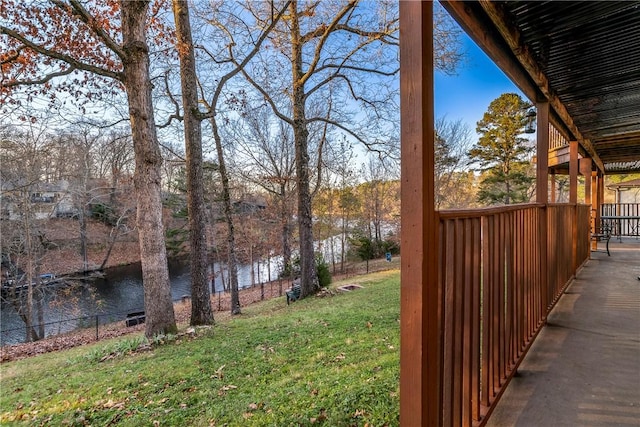 view of yard with fence and a water view