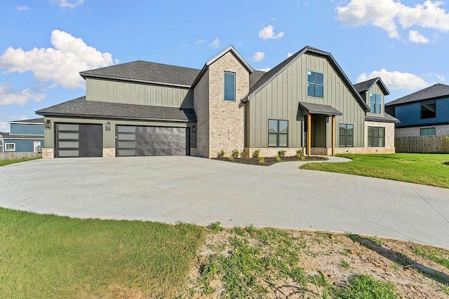 6416 S 59th St, Rogers, AR 72758 - modern farmhouse with driveway, board and batten siding, a shingled roof, a garage, and stone siding