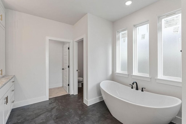 6416 S 59th St, Rogers, AR 72758 - full bathroom featuring a freestanding bath, healthy amount of natural light, vanity, and recessed lighting
