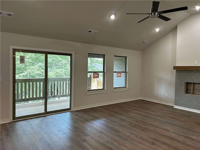 34 Brierfield Ln, Bella Vista, AR 72714 - unfurnished living room with plenty of natural light, dark wood-style floors, lofted ceiling, and recessed lighting