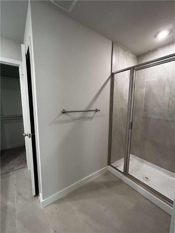34 Brierfield Ln, Bella Vista, AR 72714 - bathroom with a stall shower and a walk in closet