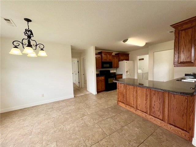 1650 Affirmed Ln, Prairie Grove, AR 72753 - kitchen with black appliances, washing machine and dryer, a peninsula, brown cabinets, and a chandelier