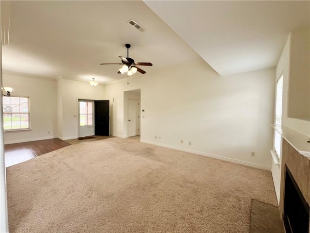 1650 Affirmed Ln, Prairie Grove, AR 72753 - unfurnished living room featuring a fireplace with flush hearth, ceiling fan, and carpet floors