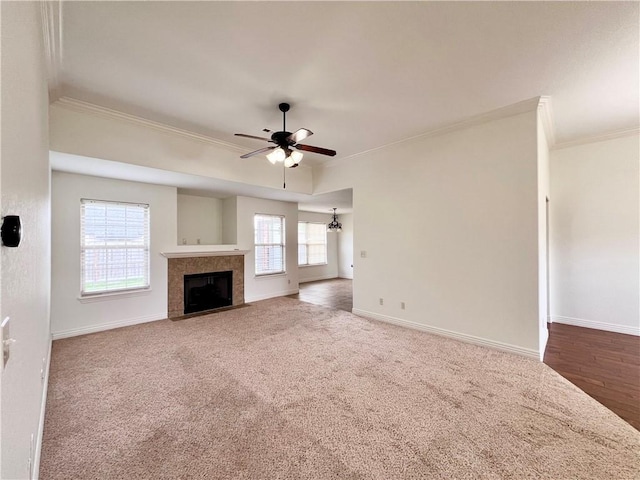 1650 Affirmed Ln, Prairie Grove, AR 72753 - unfurnished living room featuring ornamental molding, ceiling fan, a fireplace, and carpet floors