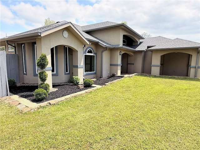 14689 Frisco Springs Rd, Lowell, AR 72745 - view of front of property featuring stucco siding and a front lawn