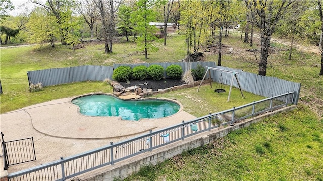 view of swimming pool featuring a fenced backyard, a fenced in pool, a patio, and a lawn