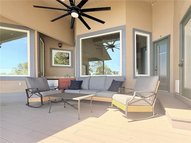 view of patio / terrace with a deck, ceiling fan, and an outdoor hangout area