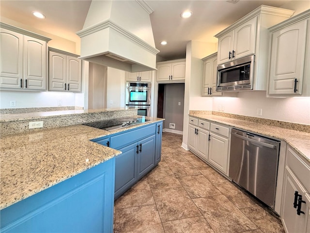 kitchen featuring recessed lighting, light stone counters, stainless steel appliances, and blue cabinets
