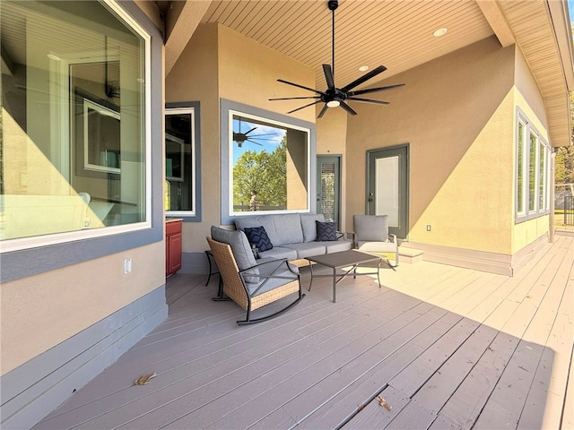 deck with a ceiling fan and outdoor lounge area