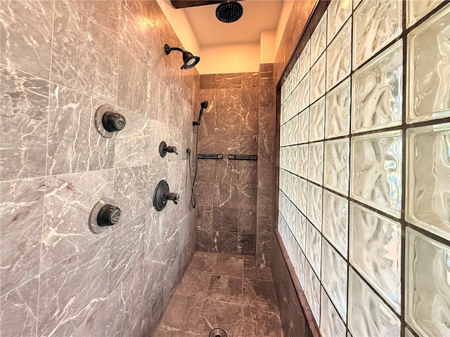 full bath featuring a tile shower