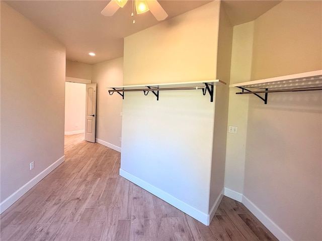14689 Frisco Springs Rd, Lowell, AR 72745 - spacious closet featuring ceiling fan and wood finished floors