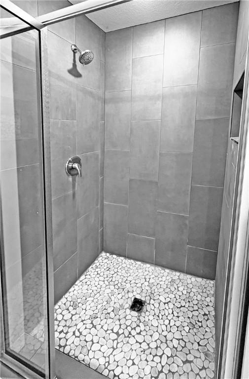 bathroom featuring a stall shower