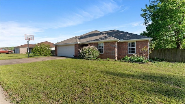 single story home featuring fence, a front lawn, driveway, brick siding, and a garage
