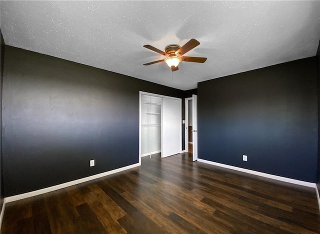 4802 Greenbriar Ln, Everton, AR 72633 - empty room with wood finished floors, a ceiling fan, baseboards, and a textured ceiling