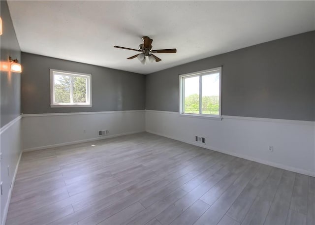 4802 Greenbriar Ln, Everton, AR 72633 - spare room featuring ceiling fan, a healthy amount of sunlight, and visible vents
