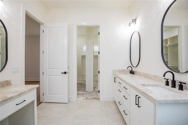 4708 Fieldcrest Ter, Rogers, AR 72758 - bathroom with double vanity and a spacious closet