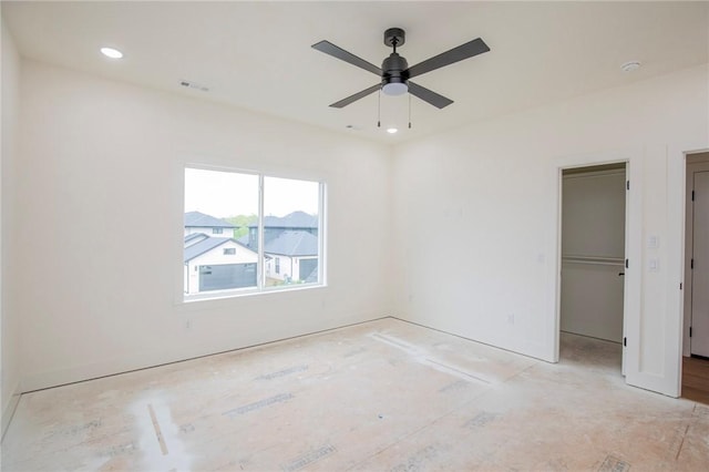 4708 Fieldcrest Ter, Rogers, AR 72758 - unfurnished bedroom featuring a spacious closet, recessed lighting, a closet, and ceiling fan