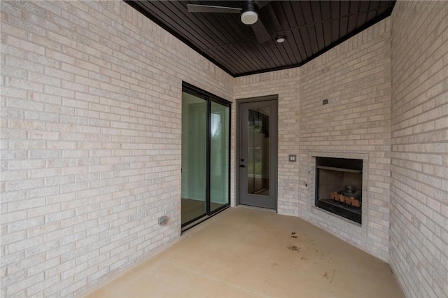 4708 Fieldcrest Ter, Rogers, AR 72758 - view of patio / terrace featuring ceiling fan and an outdoor brick fireplace